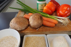 Zutaten, Portobello-Pilz,Fleischersatz, Reis, Karotten, Paprika