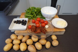 zutaten,Kartoffelecken-Salat,Rucola,Tomaten,Oliven